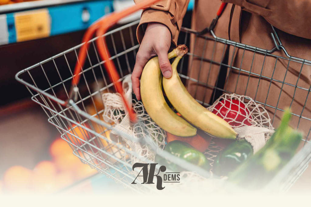 Bananas in a metal shopping cart at a grocery store.