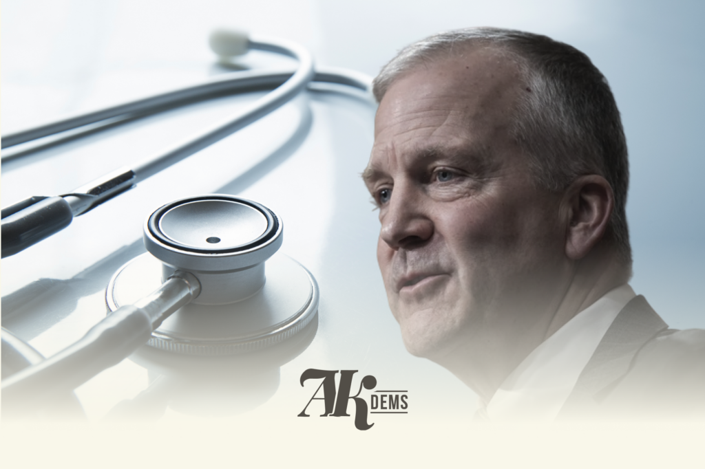 Close-up of a doctor with a stethoscope on a reflective surface, with the logo text 'AK DEMS' overlaid.