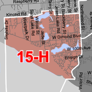 Map showing a red-shaded district labeled '15-H' along a waterfront, with surrounding street names visible.
