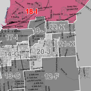 City zoning map with pink and gray blocks labeled by district codes (e.g., 18-L, 19-J, 22-K, 12-F).