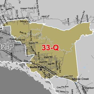 Map of a district outlined in yellow with '33-Q' in red, showing nearby roads and places such as North Pole and Moose Creek.