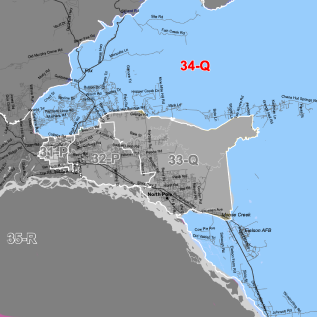 Coastal map showing gray land and blue sea with labeled zones; red '34-Q' marks a zone amid other labels like 31-P, 32-P, and 33-Q.