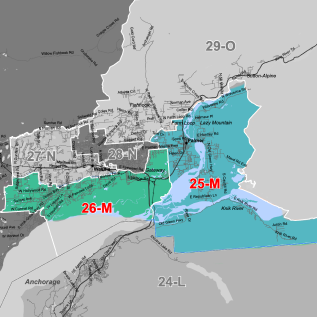 Color-coded regional map showing zones 25-M and 26-M in teal/green with surrounding gray areas and labeled landmarks along roads and mountain ranges.